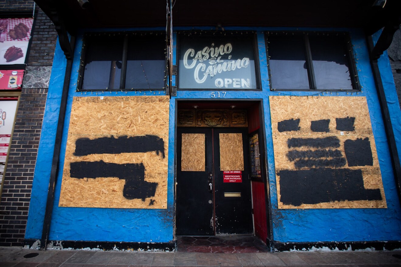 A boarded up business is pictured on 6th Street in downtown Austin. Businesses across the city were shutdown due to the global coronavirus pandemic. 